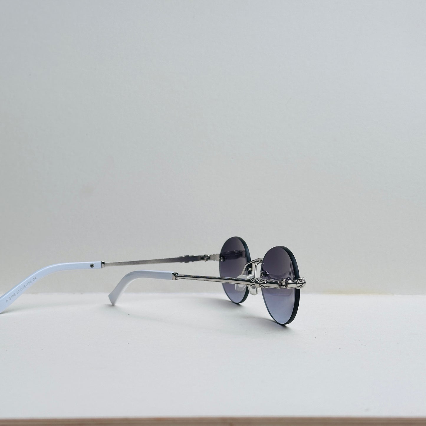TomHardee Rimless Oval Black-Shaded Sunglasses with Silver-Crafted Temples