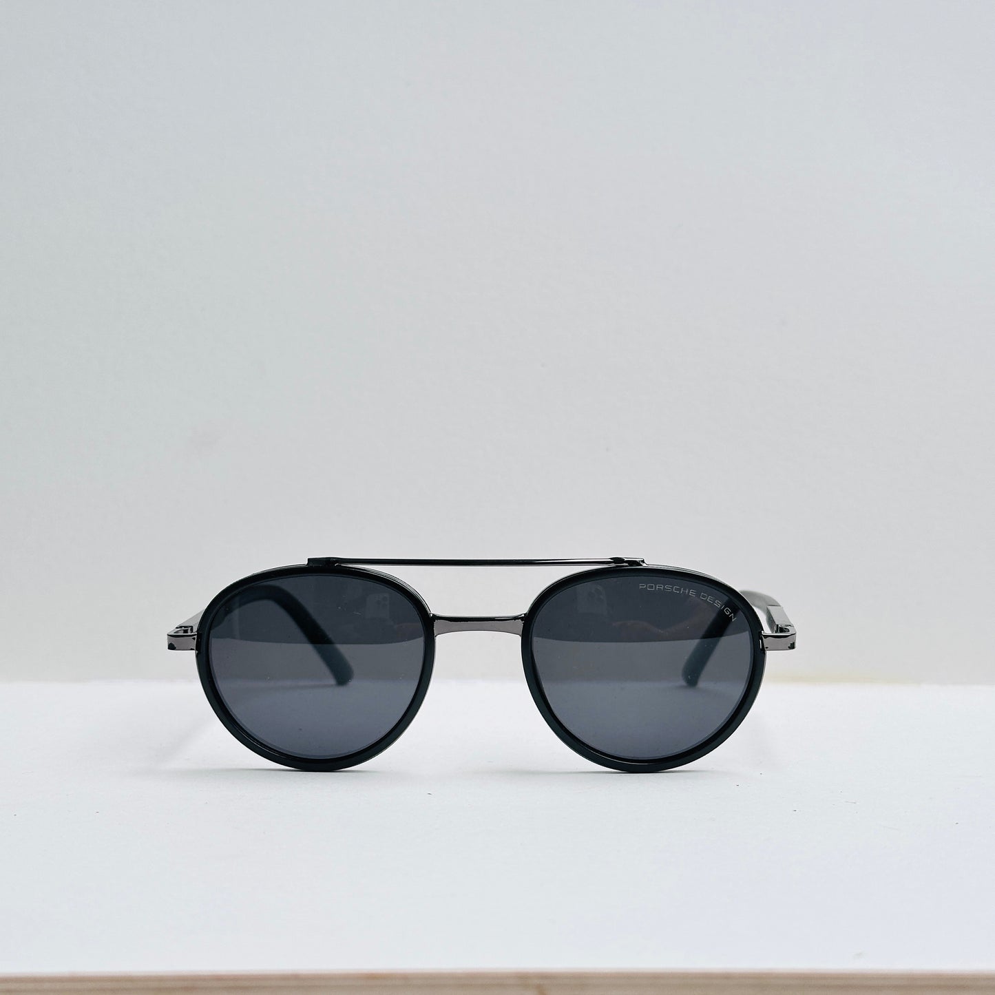 Porsche Oval Black Sunglasses with Metallic Grey Frame
