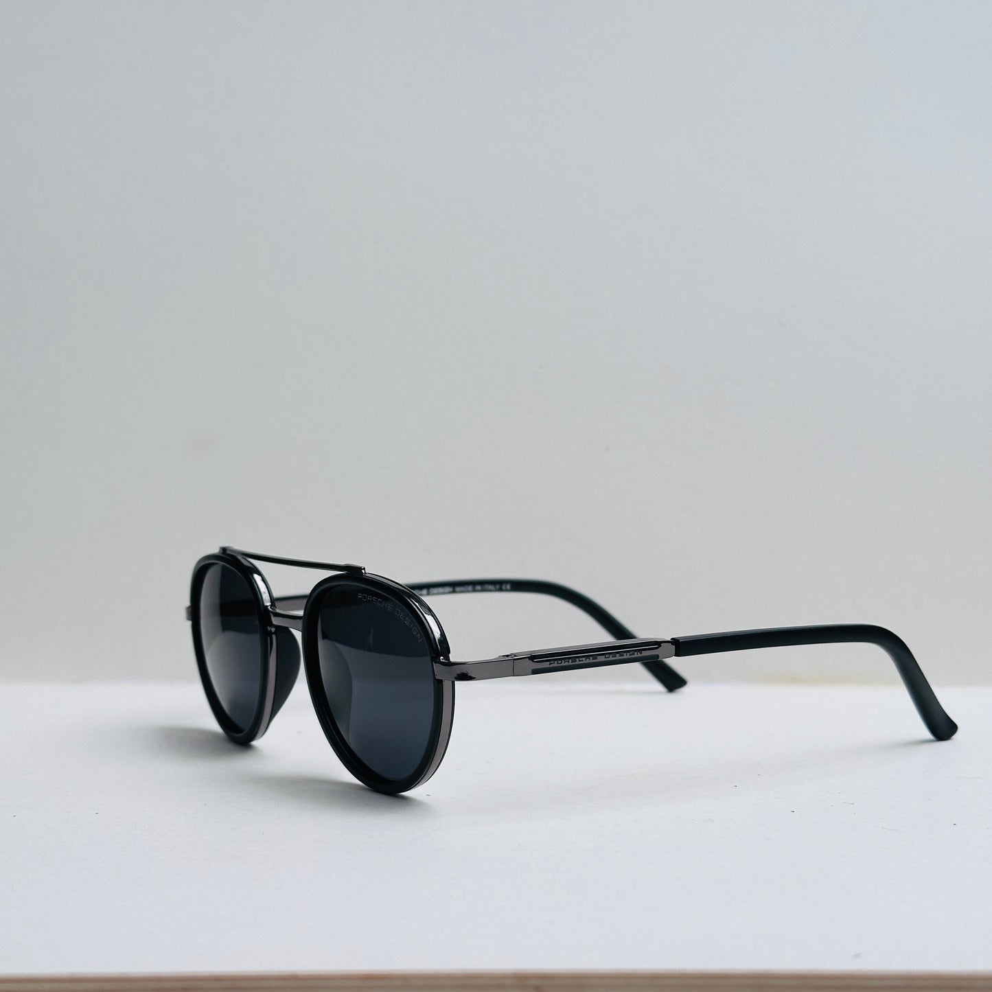 Porsche Oval Black Sunglasses with Metallic Grey Frame