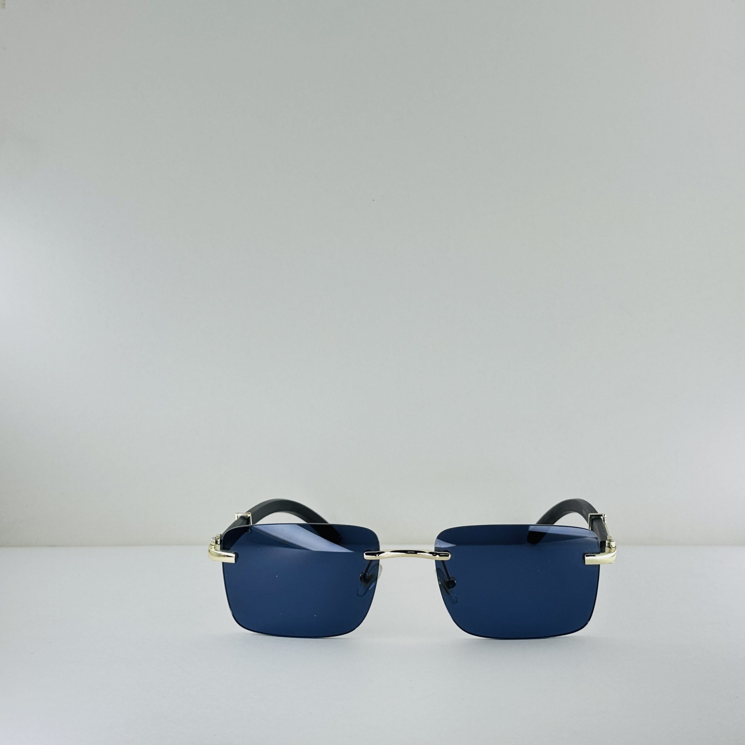 Cartier Signature Series – Rimless Blue Lens Sunglasses with Gold & Wood Accents