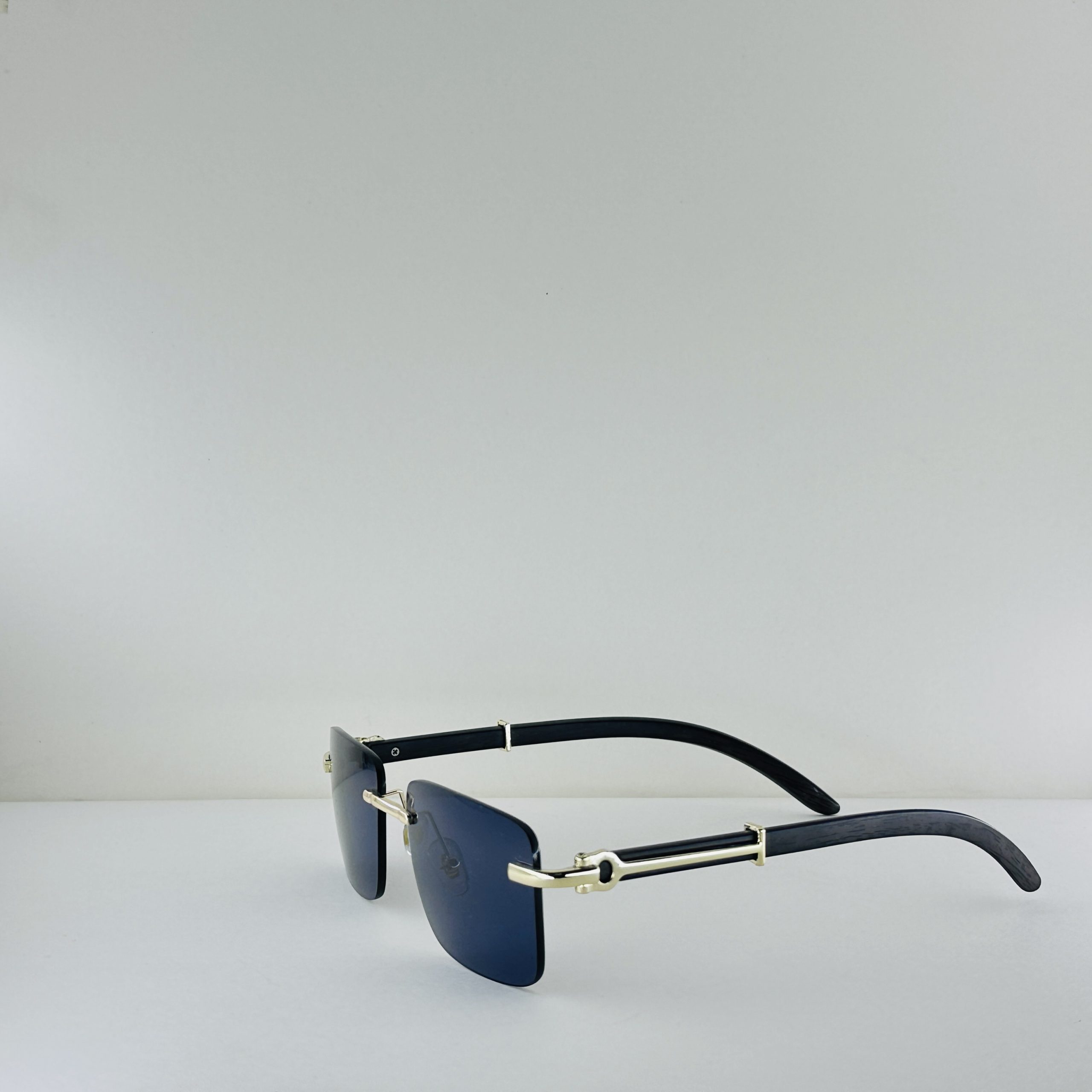 Cartier Signature Series – Rimless Blue Lens Sunglasses with Gold & Wood Accents - Image 2