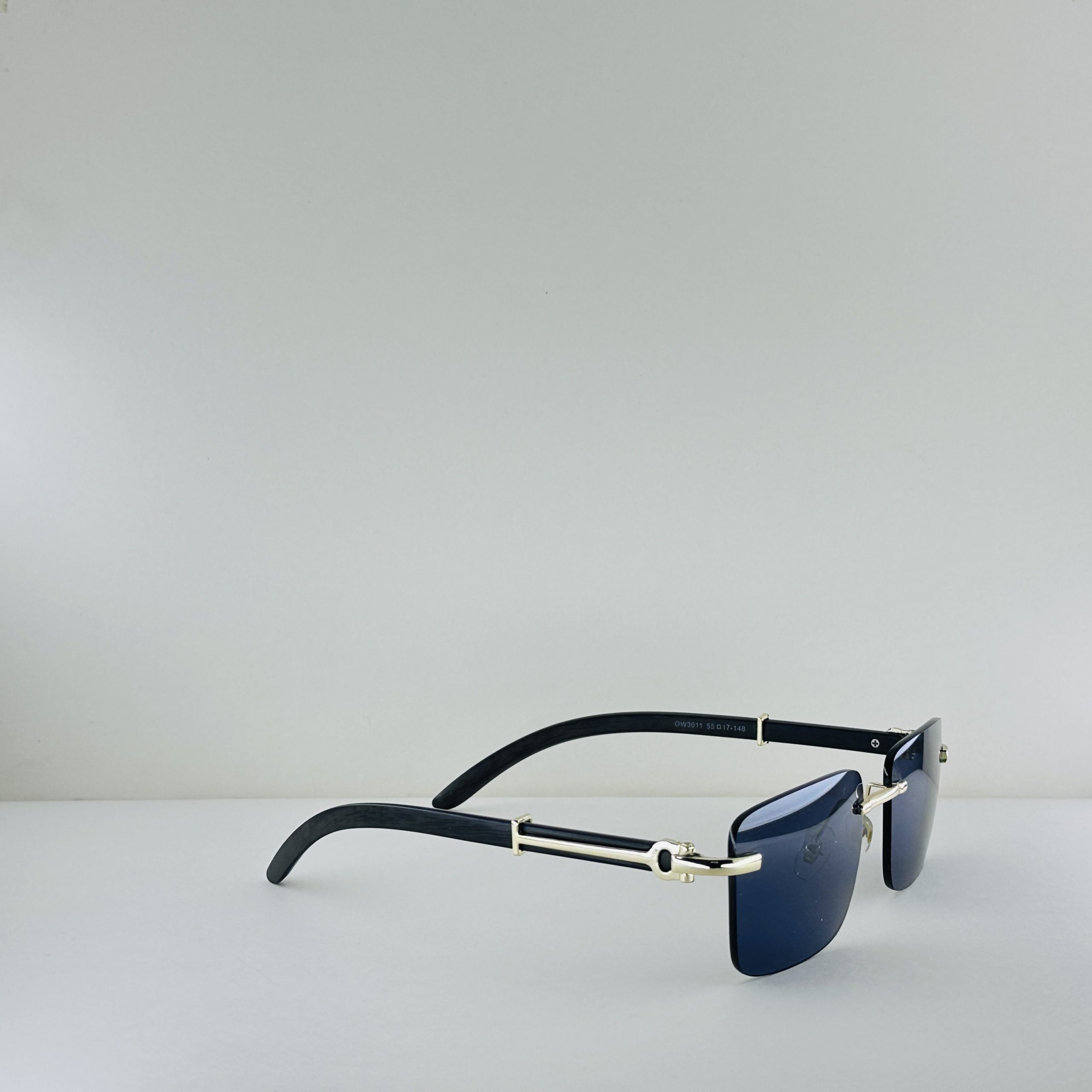 Cartier Signature Series – Rimless Blue Lens Sunglasses with Gold & Wood Accents - Image 3